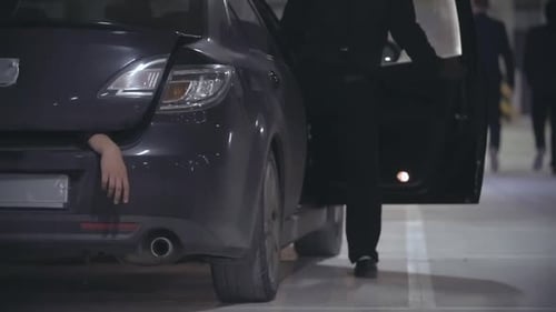 Suspenseful Car Trunk Scene in Parking Garage