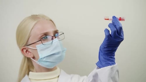 Scientist Examining Blood Sample in Test Tube