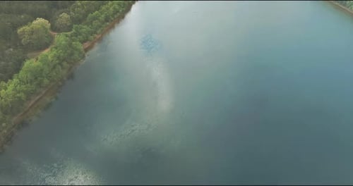 Panoramic View on Blue Water in a Forest Lake with Trees Large Panorama