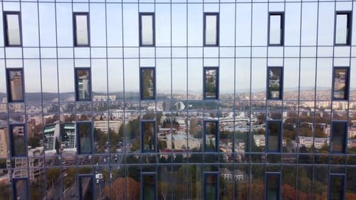 City Reflections On The Glass Building
