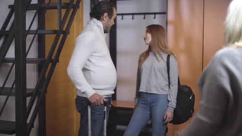 Caucasian Woman See Off Husband and Daughter for Trip. Teenage Girl and Adult Man Putting on Covid