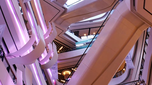 Crowd of Shoppers on Escalator in Shopping Mall