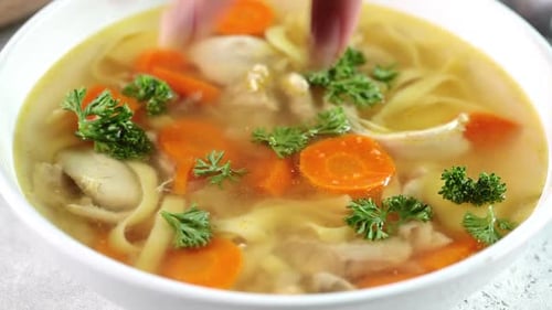 Chicken Noodle Soup Garnished with Fresh Parsley