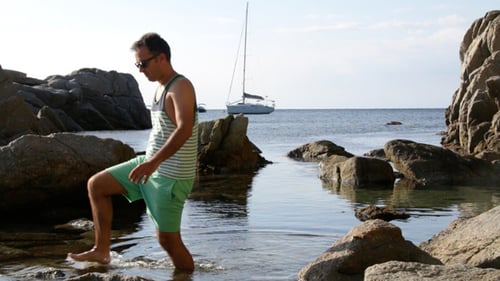 Walking Through the Beach Splashing Water