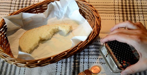 Bread Slice in Basket with Wallet and Coins