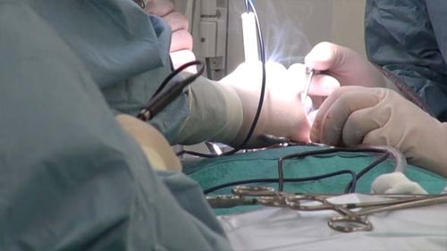 Surgeons Performing Delicate Operation in Operating Theater