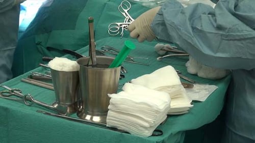 Surgical Table with Medical Instruments Prepared for Surgery
