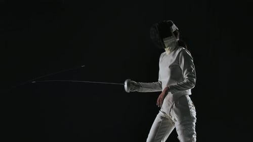 Side View of Professional Fencers Demonstrating Mastery of Foil Fencing
