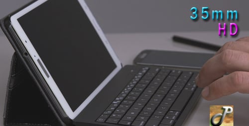 Man Typing on a Tablet Keyboard at Work