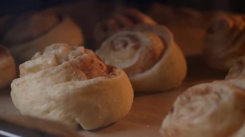 Close Up of Cinnamon Rolls Baking in Oven