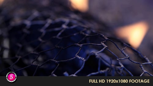 Close Up of Dark Metal Net with Flames