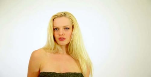 Gorgeous Sexy Woman Showing Shiny Healthy Hair in Studio