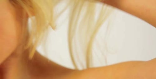 Gorgeous Sexy Woman Showing Shiny Healthy Hair in Studio