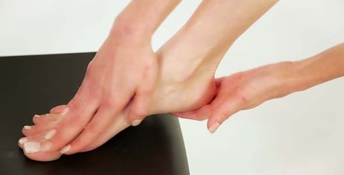 Woman Using Foot Cream 2
