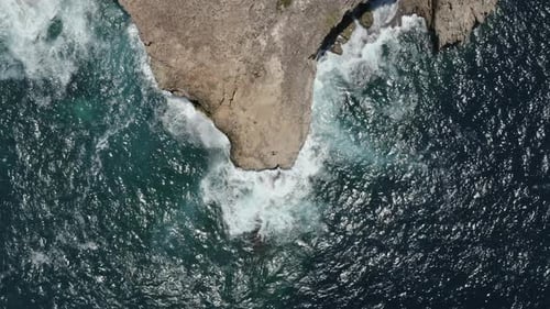 Sparkling Ocean Waters in Lombok, Indonesia and Rocky Cliff