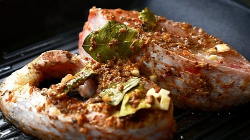 Appetizing Fish Steaks Cooking on Grill Pan