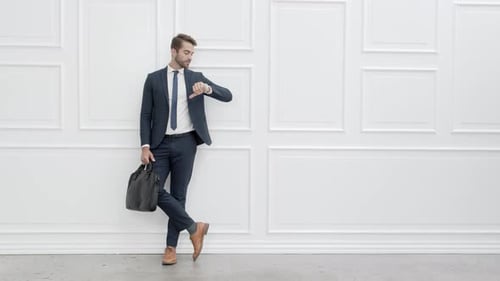 Stylish Man Waiting Leaning Against Wall
