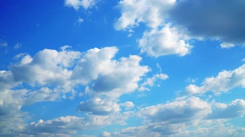 Clouds Drifting Gently in Blue Sky
