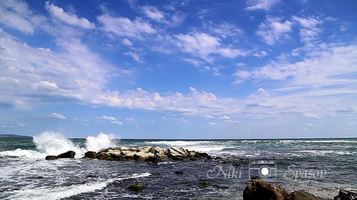 Crashing Waves on the Rocky Beach