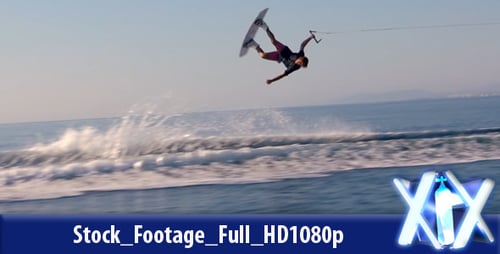 Young Adult Wakeboarding on the Ocean Doing Tricks