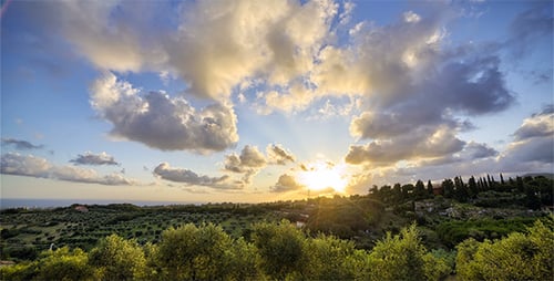 Picturesque Sunset Landscape with Moving Clouds