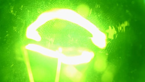 Glowing Lightbulb Filament in Extreme Close Up