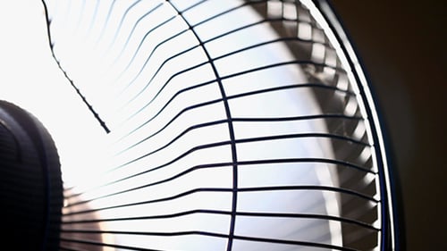 Spinning Electric Fan Creates a Cooling Breeze