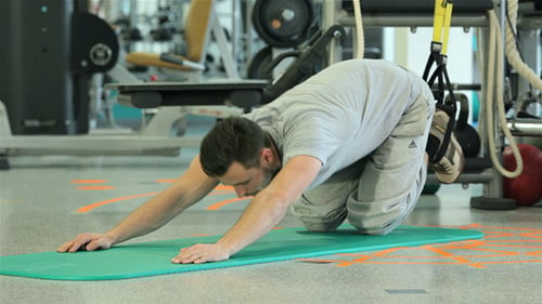 Young Man Doing Program for Extensive Muscle