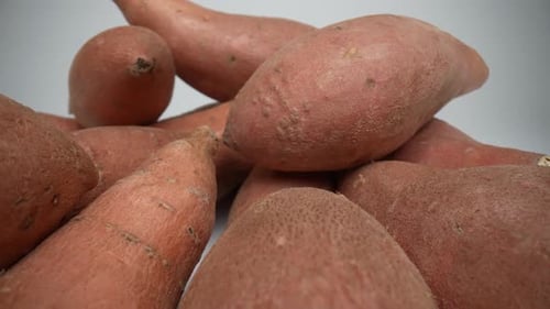 Pile of Raw Sweet Potatoes