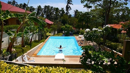 Man Swimming in Pool