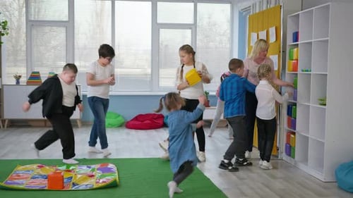 Inclusive School Female Teacher Specialist in Working with Children with Down Syndrome Conducts