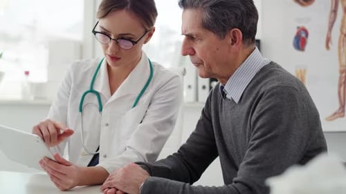Handheld view of senior man having control visit in the doctor. Shot with RED helium camera in 8K