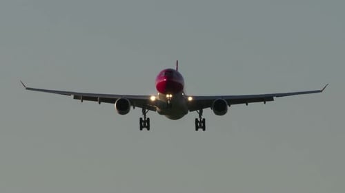 Modern Airplane Airliner Landing at Airport