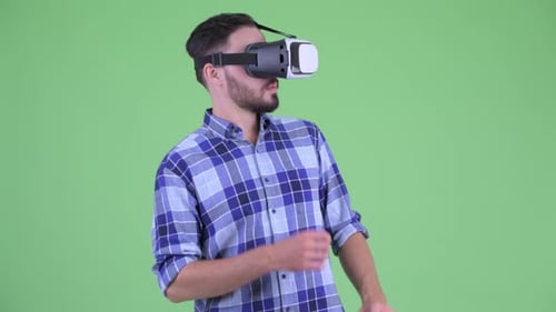Man Wearing VR Headset Interacting with Virtual World