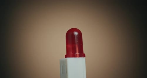Close up of a Red Light LED and Macro Shot of Electronic Components on Turn Table