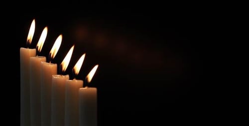 Candles Being Extinguished in Dark Room