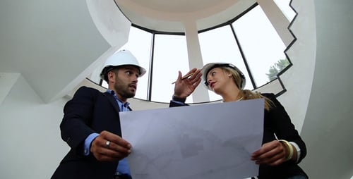 Architects Going Over Blueprints