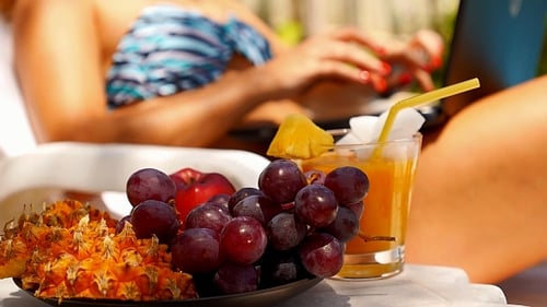 Close up Fruit Plate and Laptop in Tropics