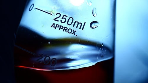 Amber Liquid in Glass Scientific Erlenmeyer Flask