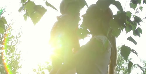 Mother and Baby Enjoying Sunlight in Forest