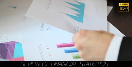Examining Colorful Business Charts and Graphs