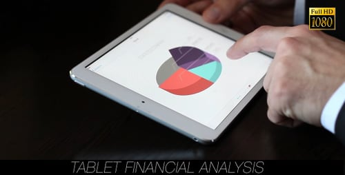 Man Analyzing Business Data on Tablet Device