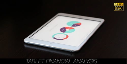 Man Analyzes Financial Data on Tablet