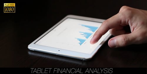 Hand Swiping on Tablet Showing Business Graphs