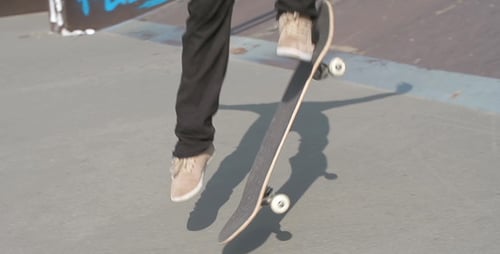 Skateboarder Doing an Ollie in a Skate Park