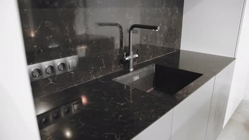 Modern Kitchen Countertop with Black Sink and Faucet