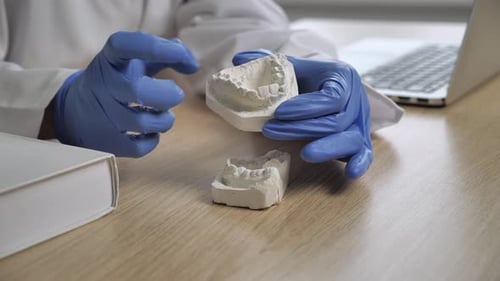 Orthodontist sitting at his desk