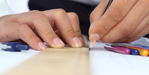 Architect Drawing with Pencil and Ruler