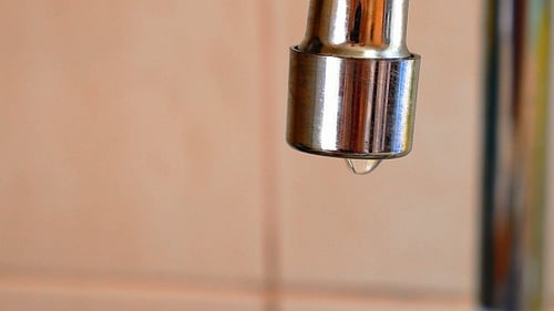 Water Dripping Slowly from Faucet Spout