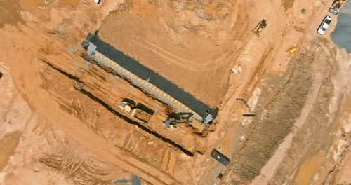 Construction Site with Heavy Machinery Aerial View